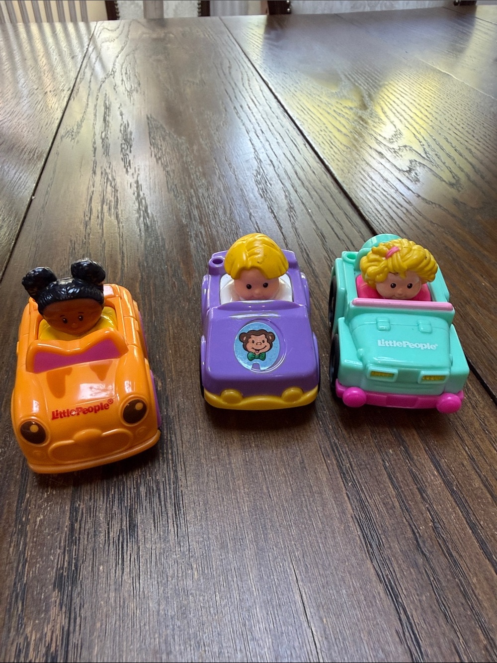 Fisher-Price Little People Wheelies lot of 3 Orange Purple Teal. years 2009-2013